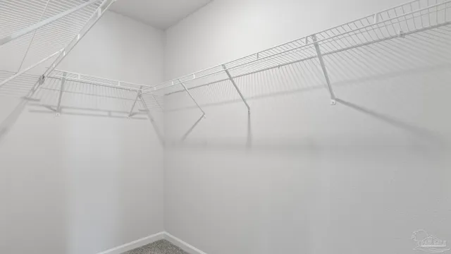 a view of a small space with wooden floor