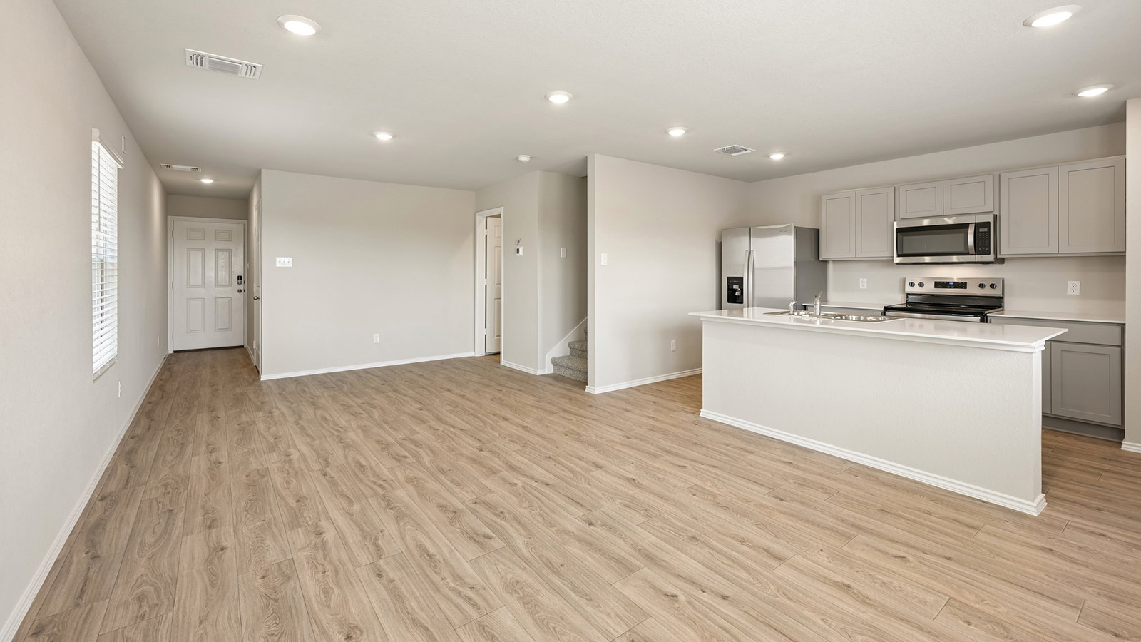 372 Old Stage Coach Road Jarrell, TX 76537 - Photo 25 of 25 An open floor plan seamlessly connects the kitchen to the spacious living area.