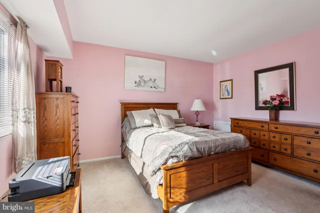 a bedroom with a bed and a table in it