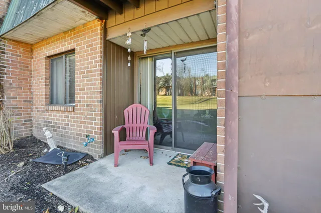 a view of a house with backyard and porch