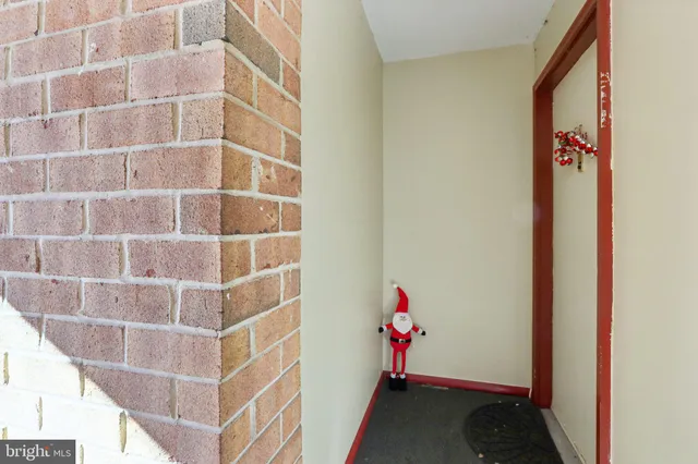 a view of a hallway with paintings on the wall