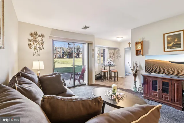 a living room with furniture and a couch