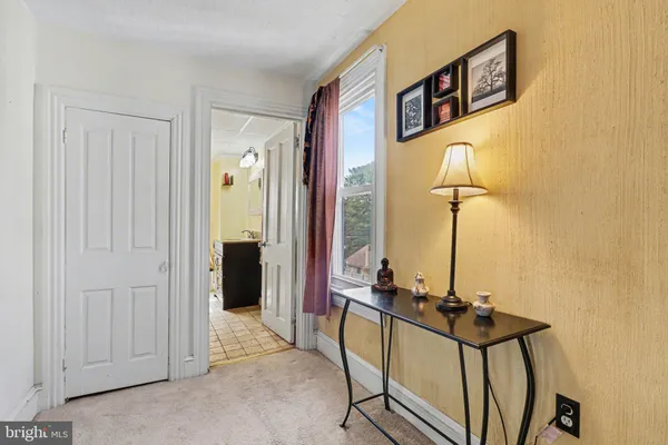 a bed room with a bed and a window