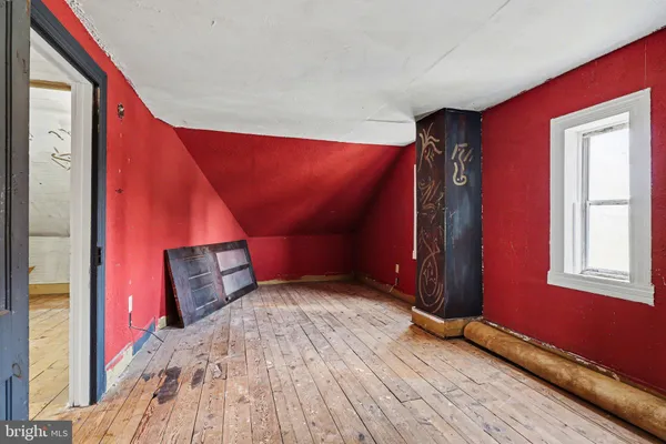 a view of a balcony with chairs and wooden floor