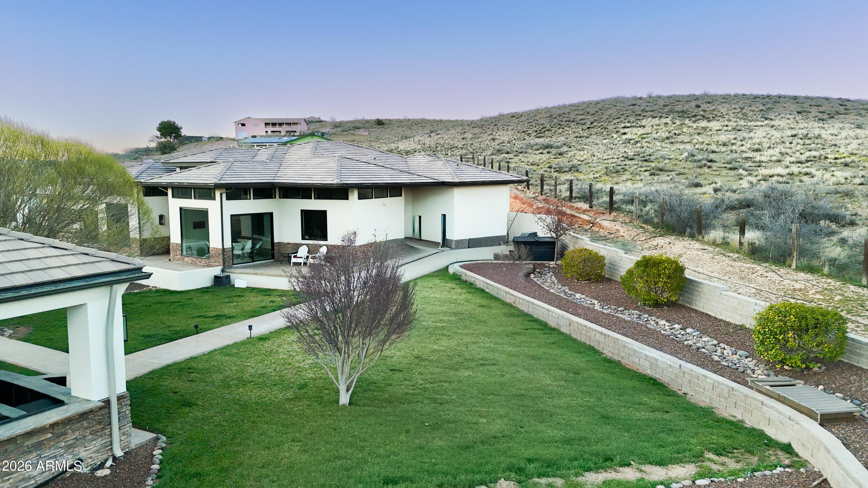 2833 South Old Church Road Camp Verde, AZ 86322 - Photo 115 of 116 a front view of a house with a yard table and chairs