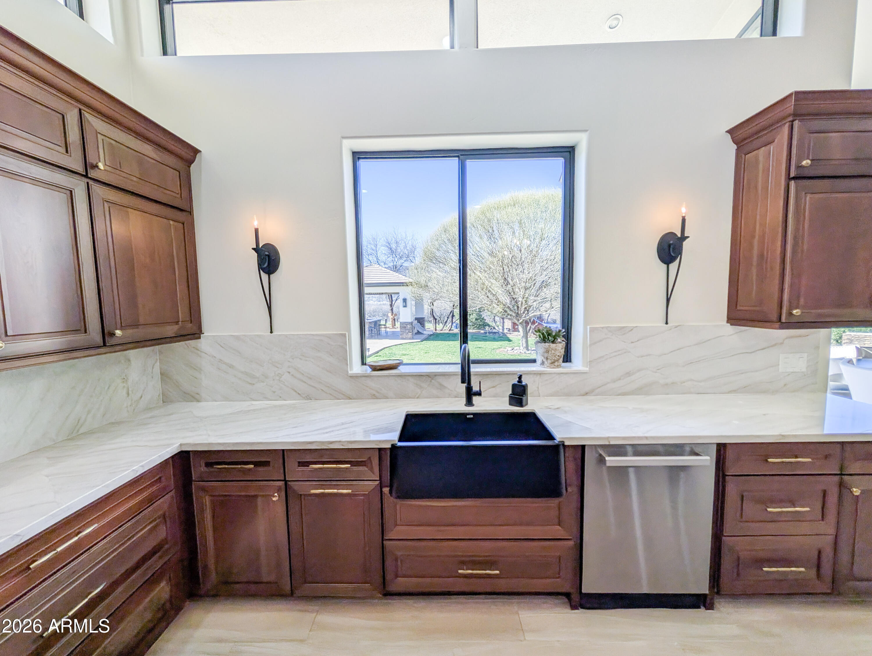 2833 South Old Church Road Camp Verde, AZ 86322 - Photo 14 of 116 a kitchen with kitchen island granite countertop a sink window and cabinets