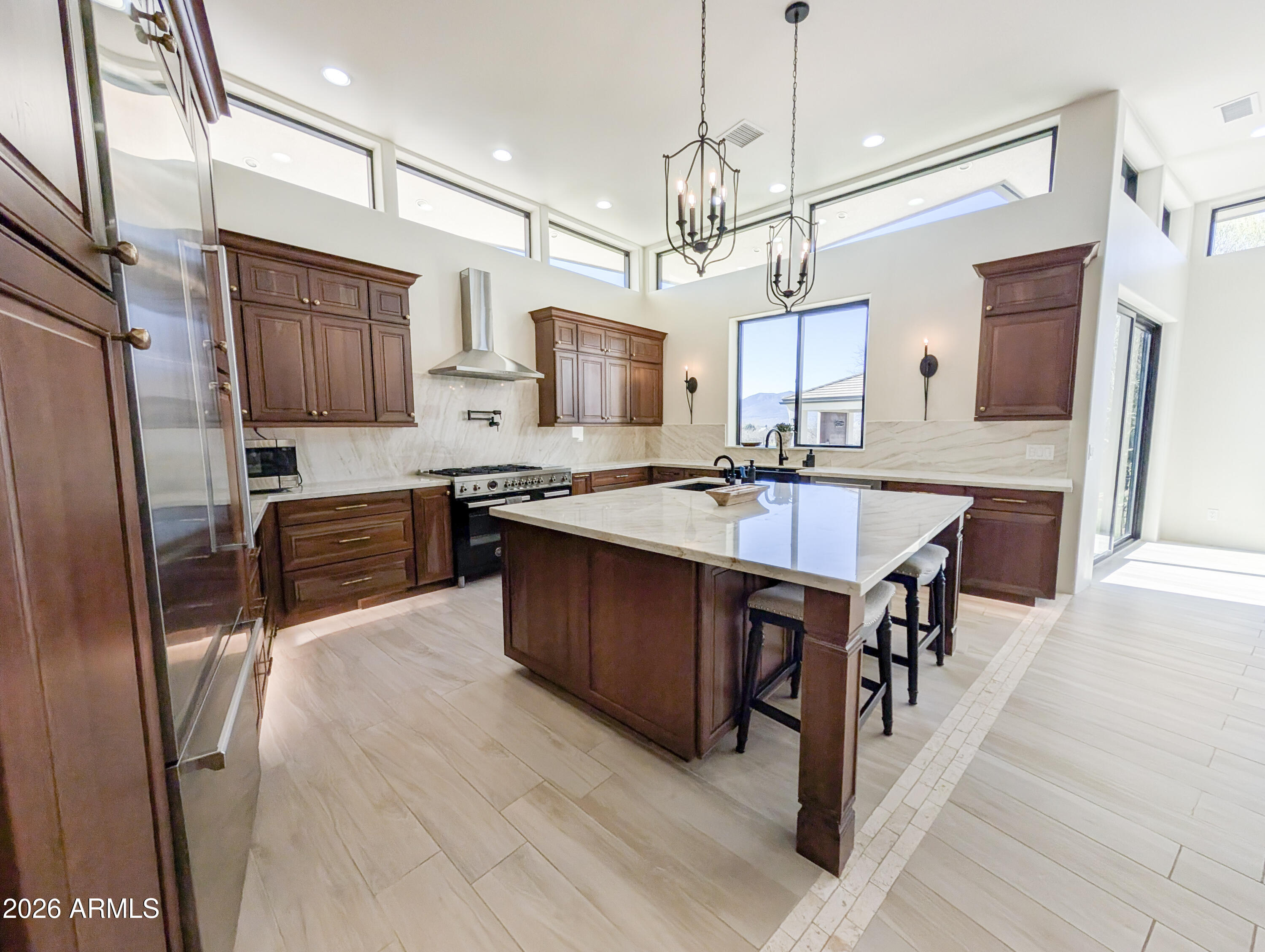 2833 South Old Church Road Camp Verde, AZ 86322 - Photo 27 of 116 a kitchen with stainless steel appliances granite countertop a sink a stove a refrigerator and island