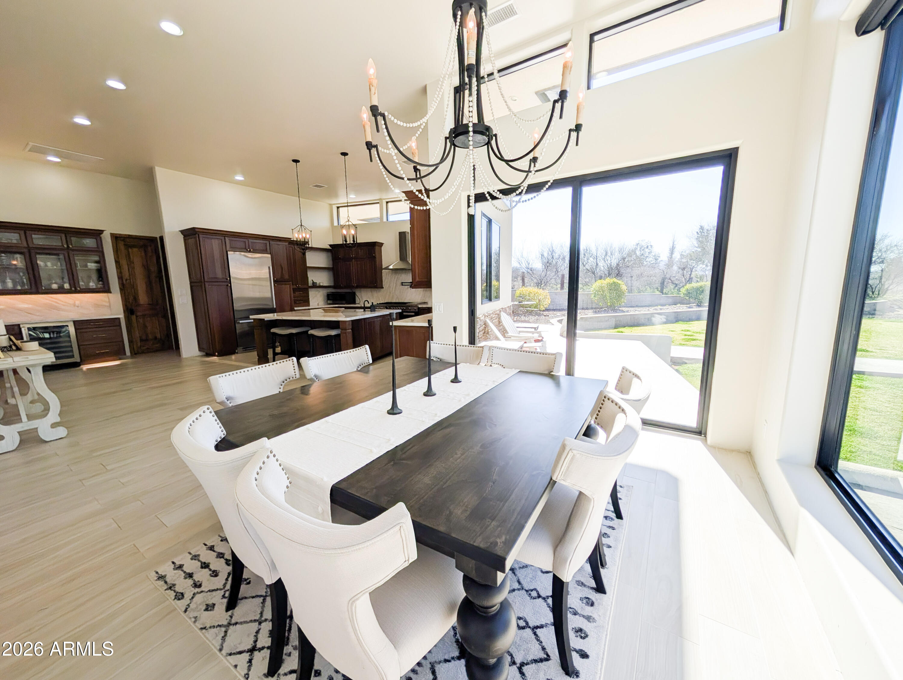 2833 South Old Church Road Camp Verde, AZ 86322 - Photo 33 of 116 a view of a dining room with furniture a chandelier and wooden floor