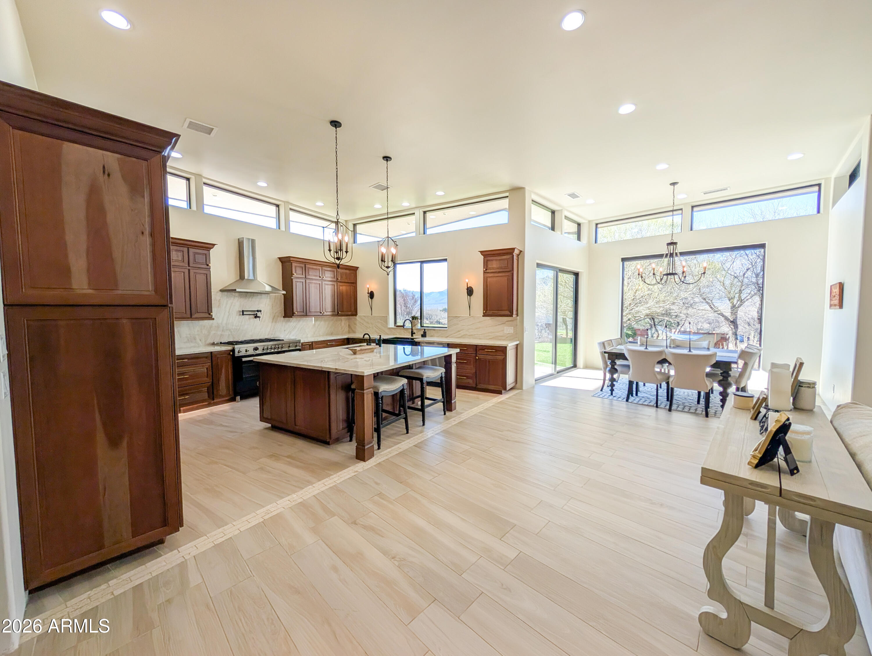 2833 South Old Church Road Camp Verde, AZ 86322 - Photo 41 of 116 a large kitchen with a table chairs refrigerator and a window