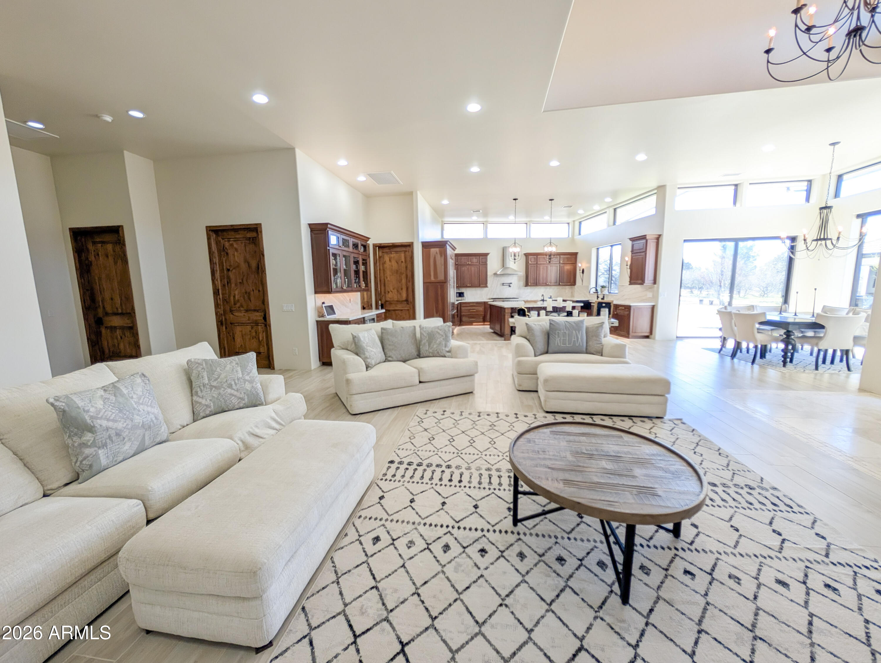 2833 South Old Church Road Camp Verde, AZ 86322 - Photo 48 of 116 a living room with furniture and a dining table with wooden floor
