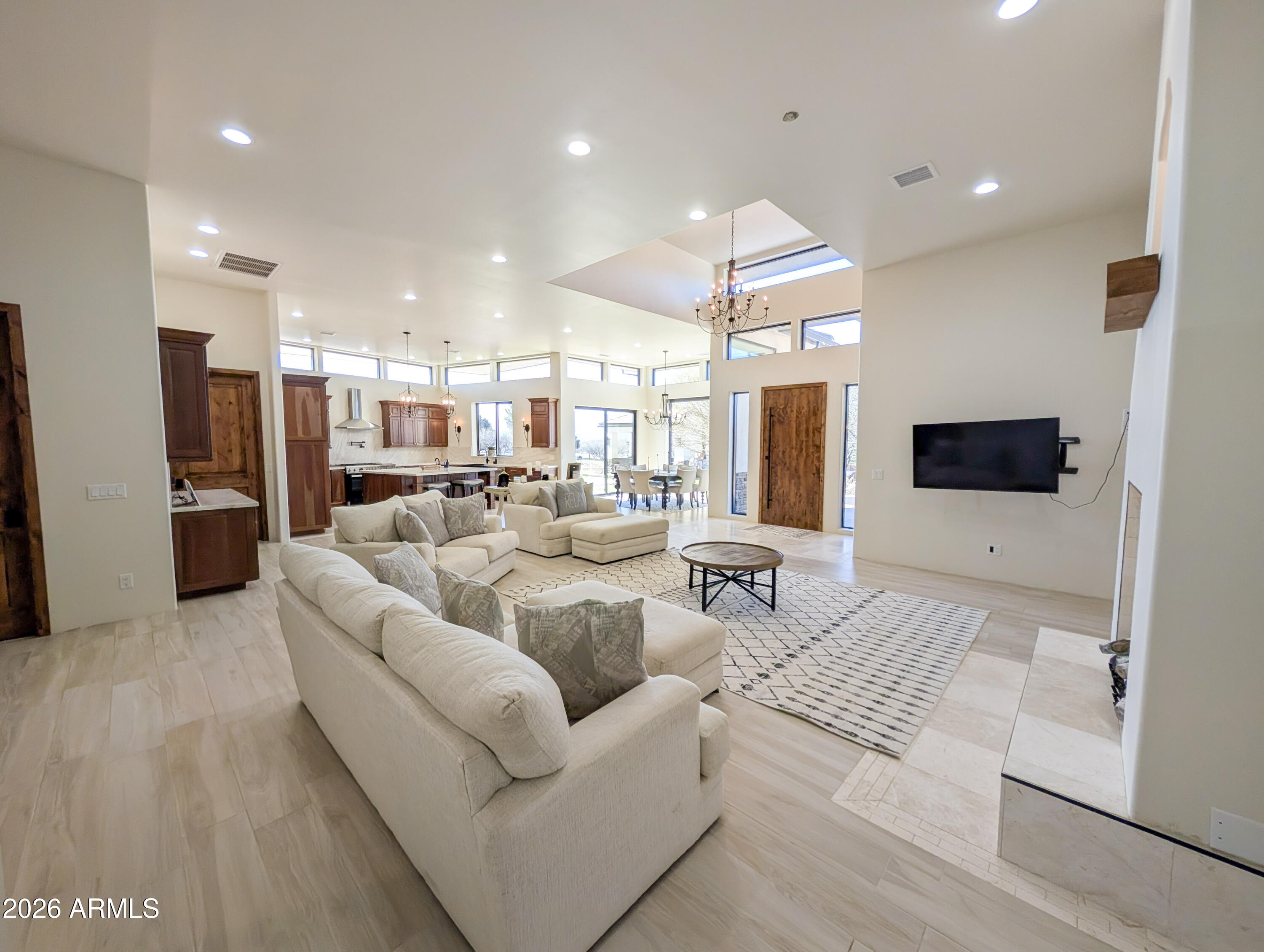 2833 South Old Church Road Camp Verde, AZ 86322 - Photo 53 of 116 a living room with couches a flat screen tv and kitchen view