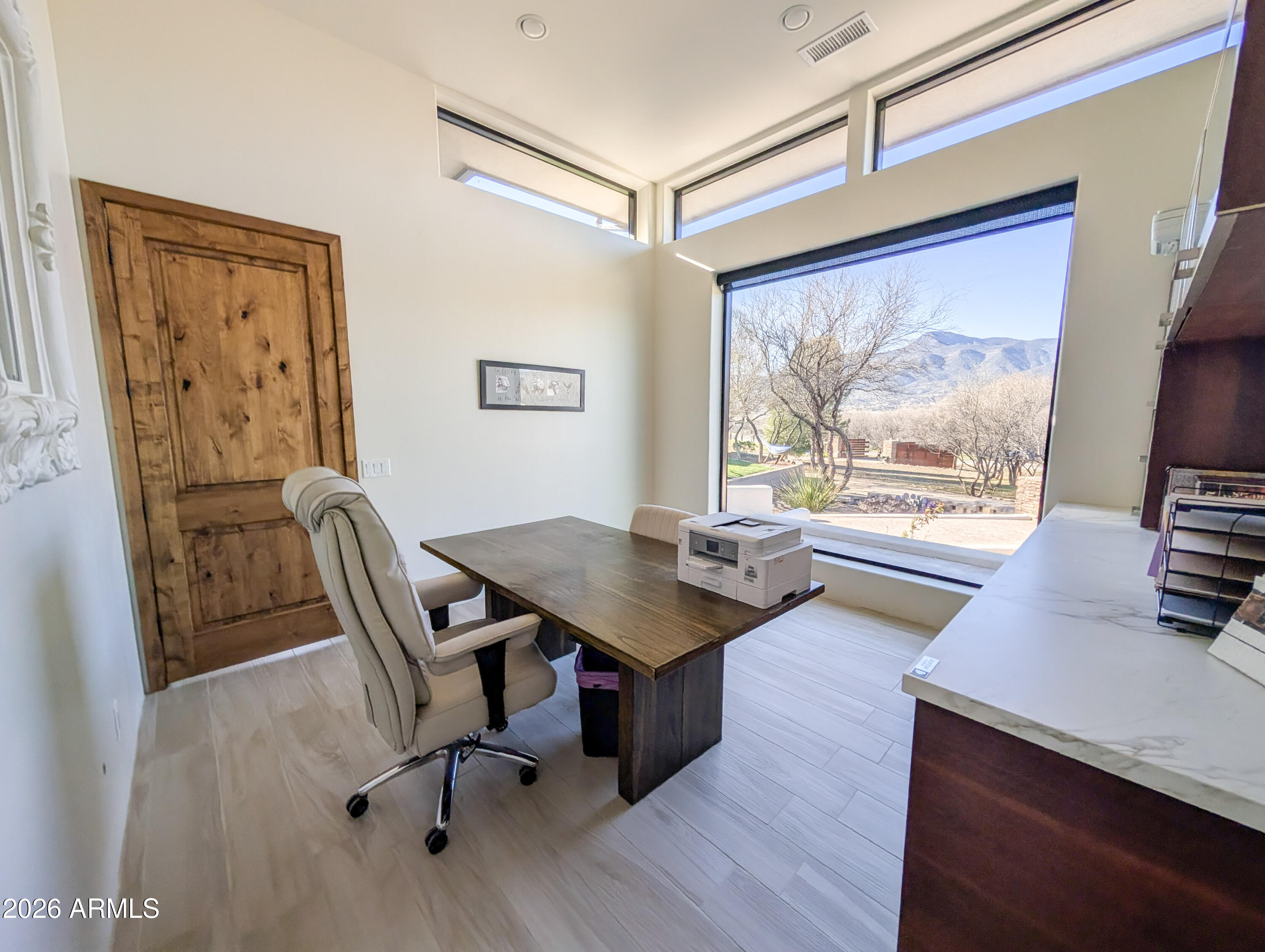 2833 South Old Church Road Camp Verde, AZ 86322 - Photo 63 of 116 a view of a workspace with furniture and a window