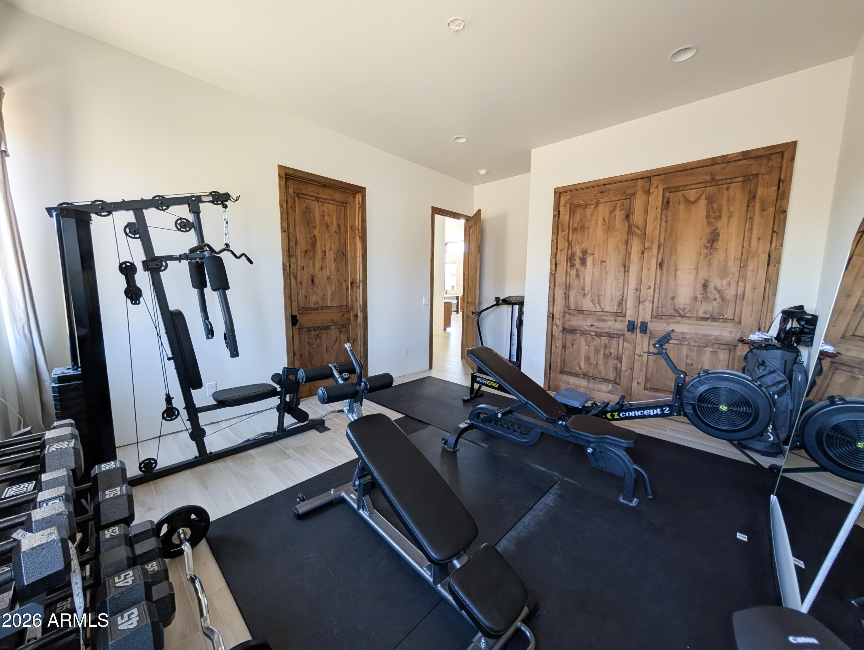 2833 South Old Church Road Camp Verde, AZ 86322 - Photo 79 of 116 a room with gym equipment and large windows