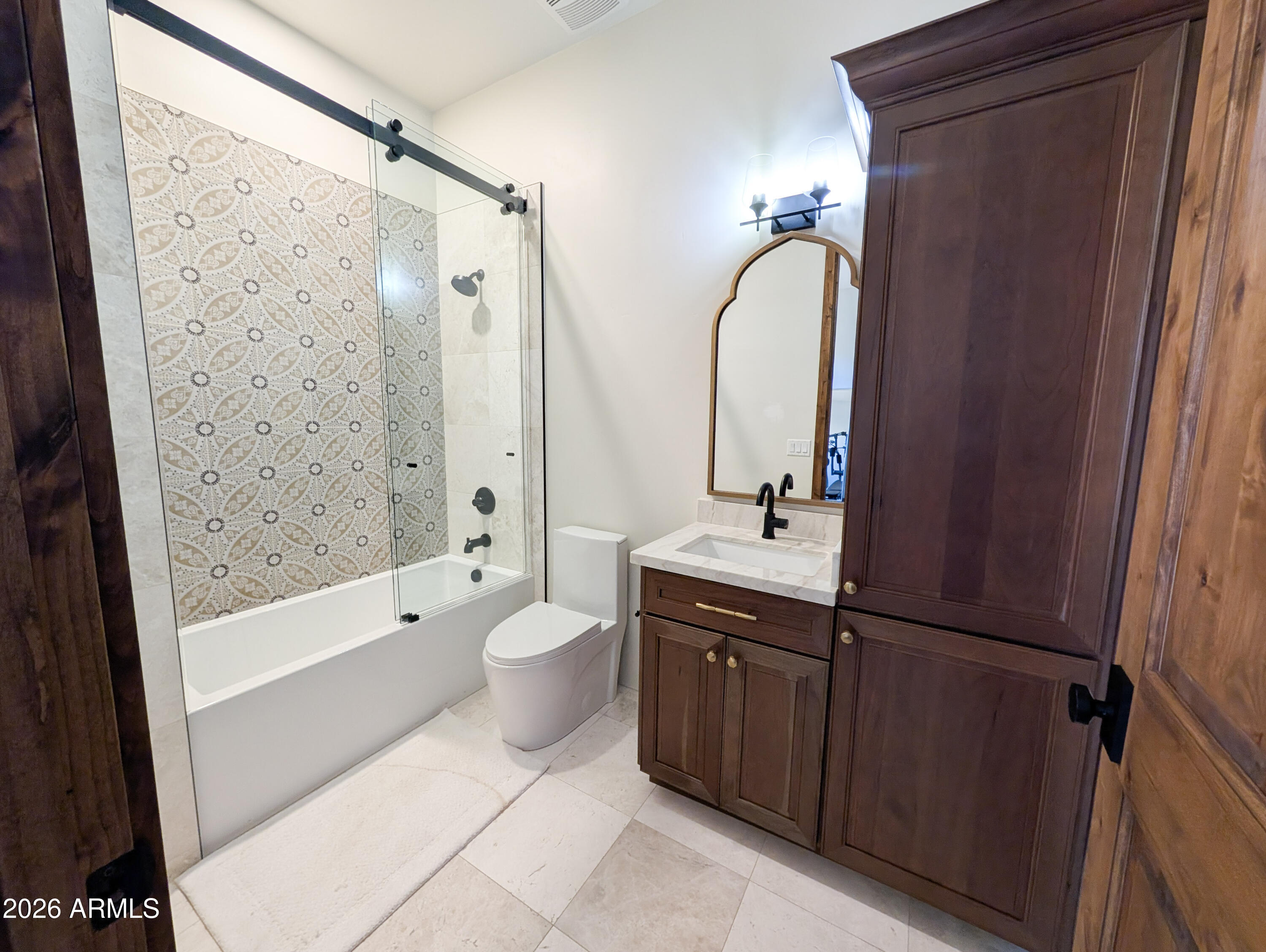 2833 South Old Church Road Camp Verde, AZ 86322 - Photo 80 of 116 a bathroom with a double vanity sink a toilet and shower
