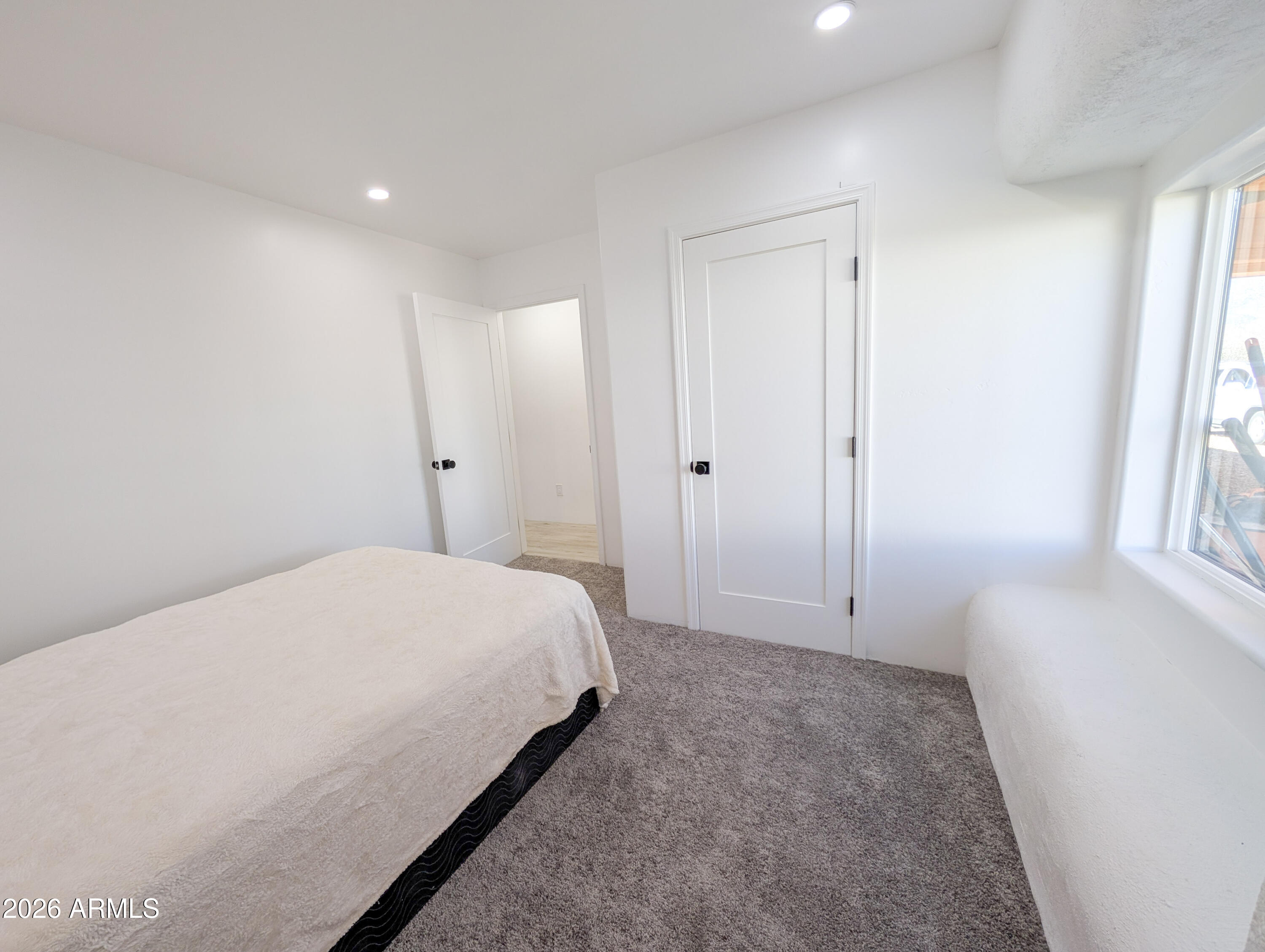 2833 South Old Church Road Camp Verde, AZ 86322 - Photo 86 of 116 a spacious bedroom with a bed and a window