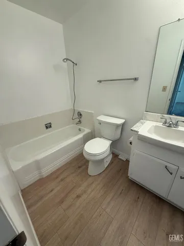 a bathroom with a sink a toilet and a bathtub