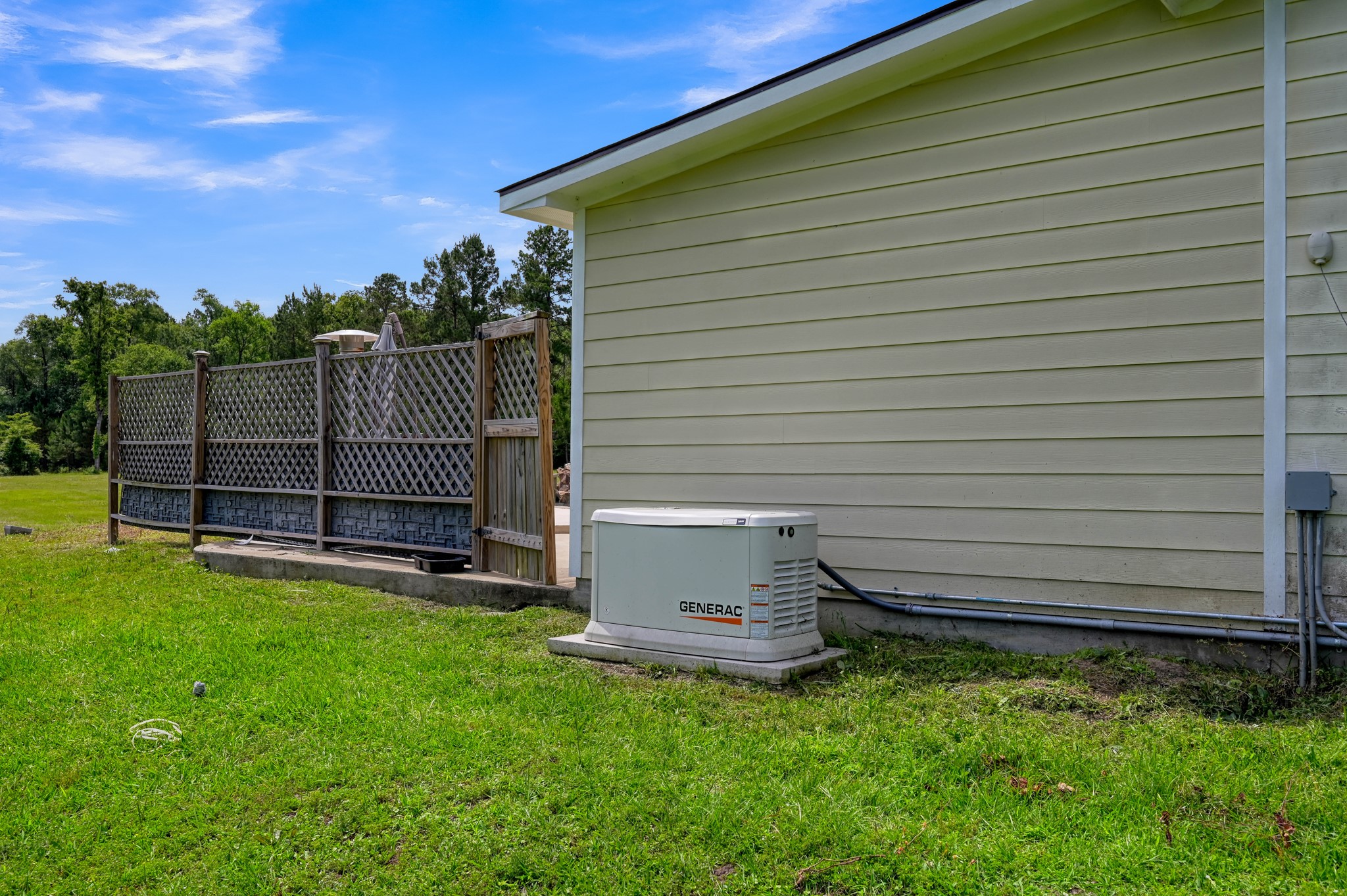 144 Wood Farm Road Huntsville, TX 77320 - Photo 30 of 35 a view of a backyard with wooden fence