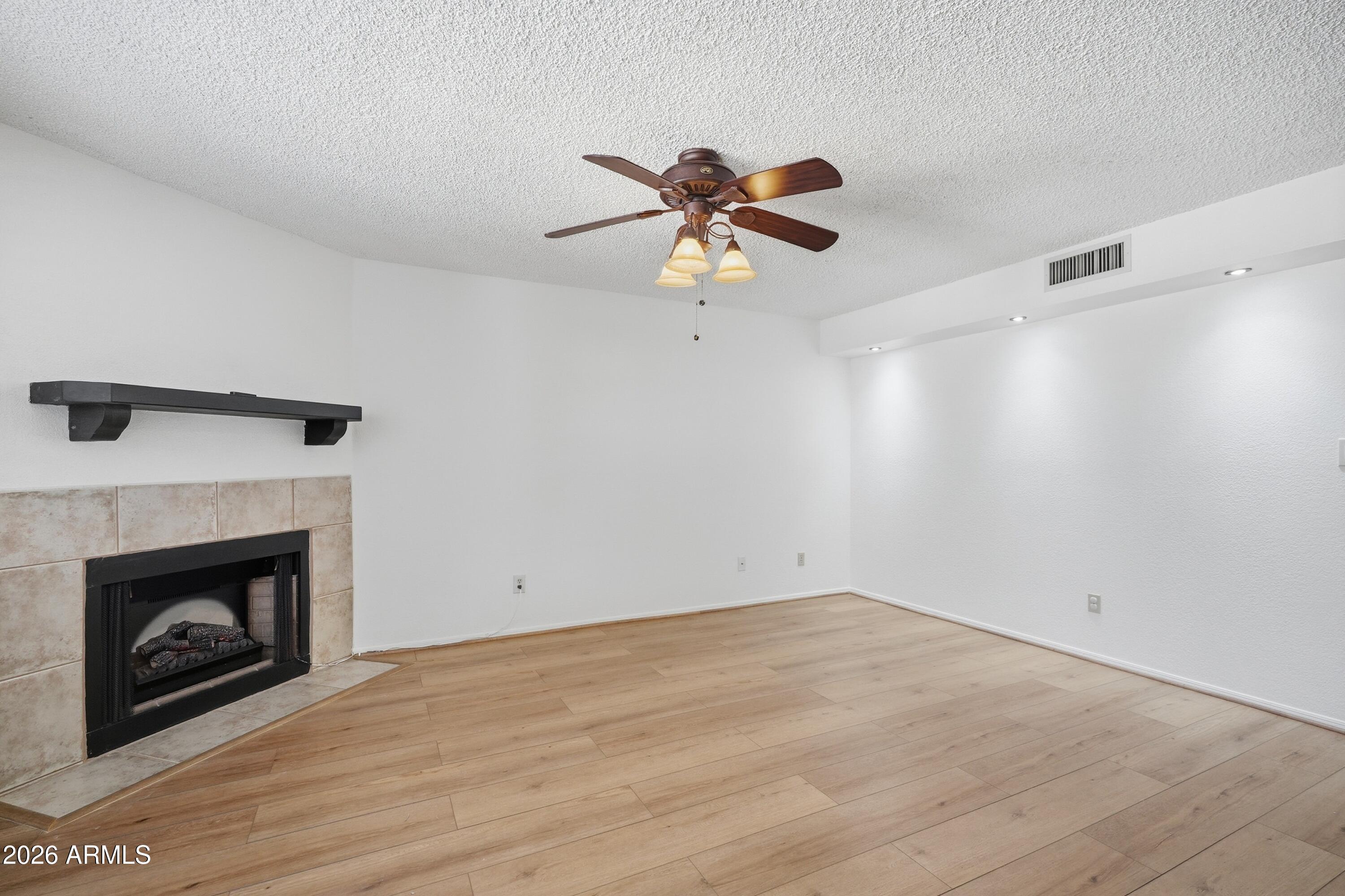 6262 East Brown Road, Unit 17 Mesa, AZ 85205 - Photo 4 of 37 Living Room with fireplace