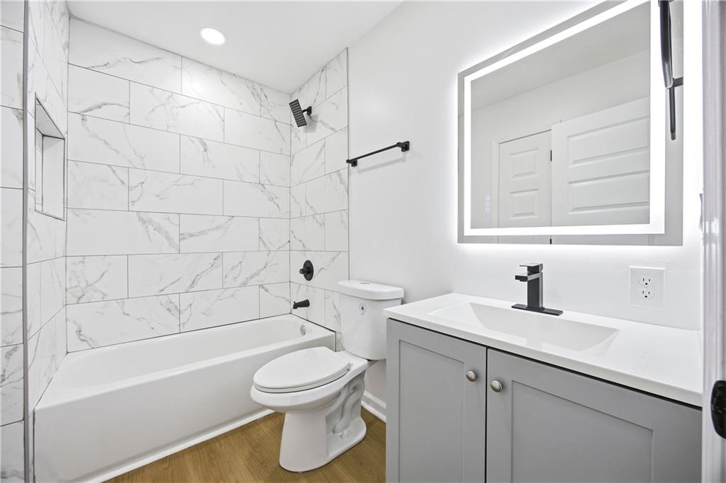 1775 Hadlock Street Southwest Atlanta, GA 30311 - Photo 23 of 27 a bathroom with a sink a toilet and shower