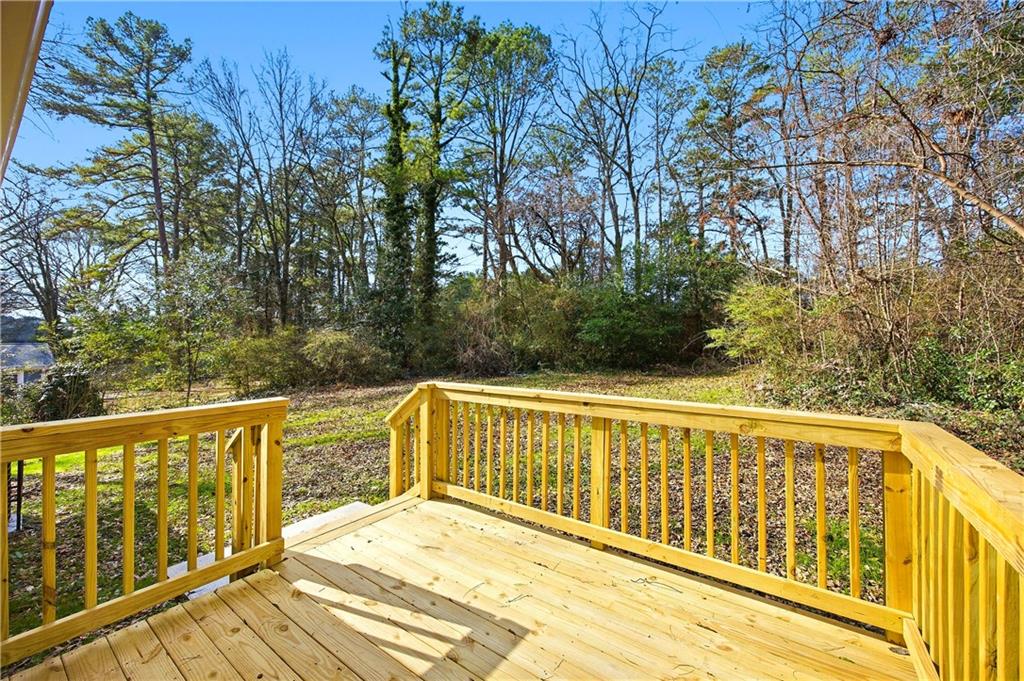 1775 Hadlock Street Southwest Atlanta, GA 30311 - Photo 25 of 27 a view of a balcony with wooden floor and fence