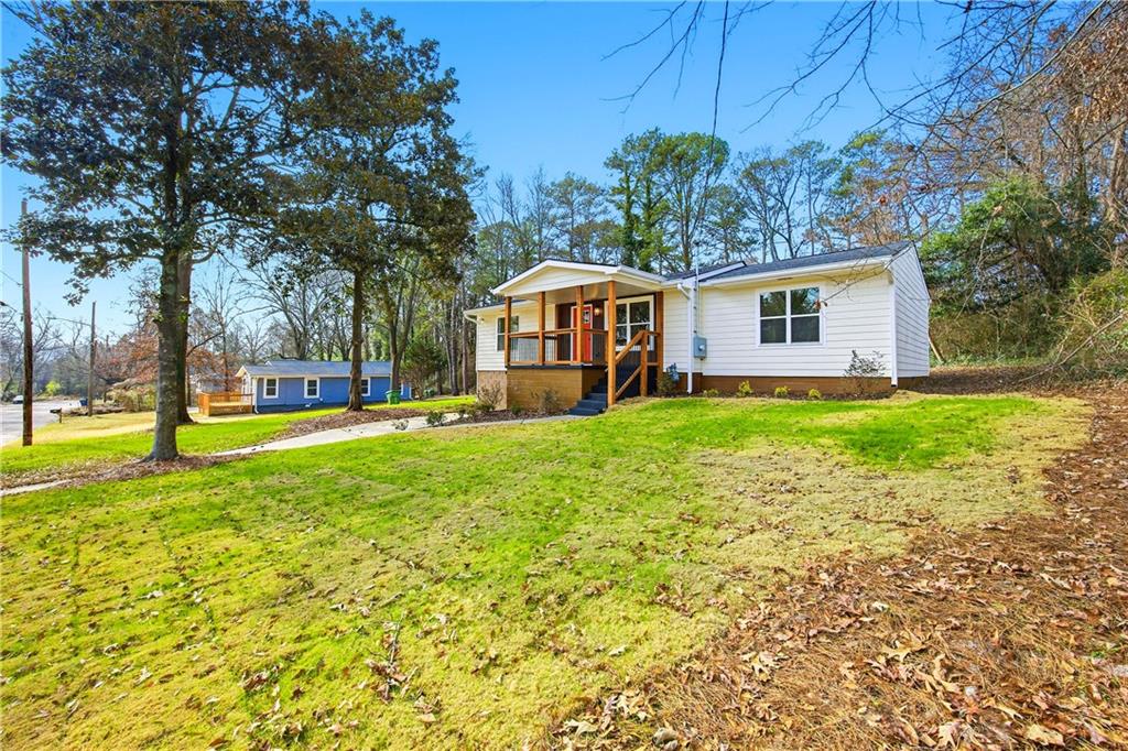 1775 Hadlock Street Southwest Atlanta, GA 30311 - Photo 3 of 27 a front view of house with yard and green space