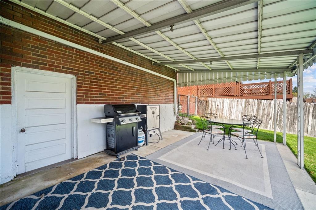 416 Phillips Avenue McKees Rocks, PA 15136 - Photo 37 of 46 a view of a patio with a table and chairs