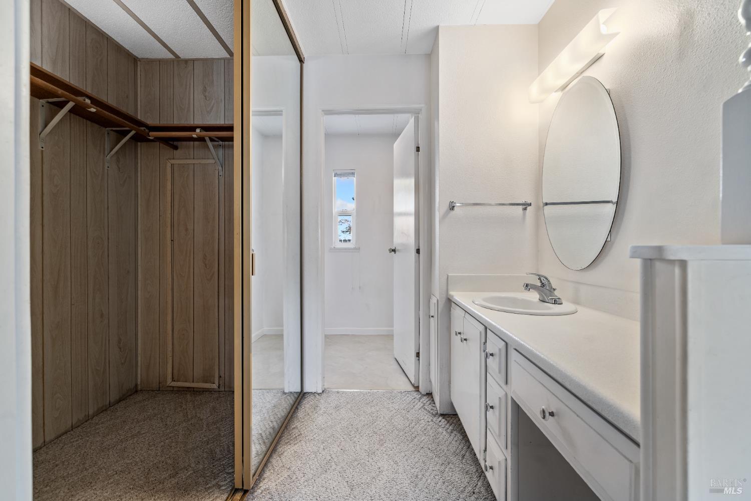 58 Círculo Puerto Rohnert Park, CA 94928 - Photo 19 of 30 a bathroom with a double vanity sink a mirror and a shower