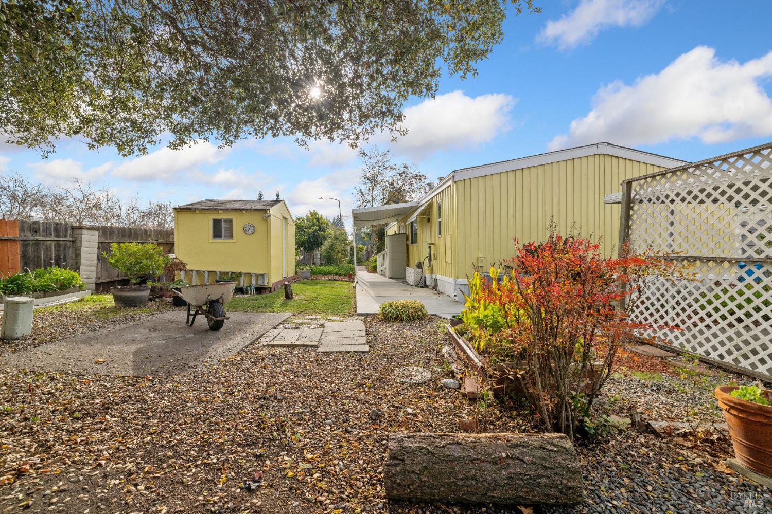 58 Círculo Puerto Rohnert Park, CA 94928 - Photo 22 of 30 a view of a patio with table and chairs under an umbrella