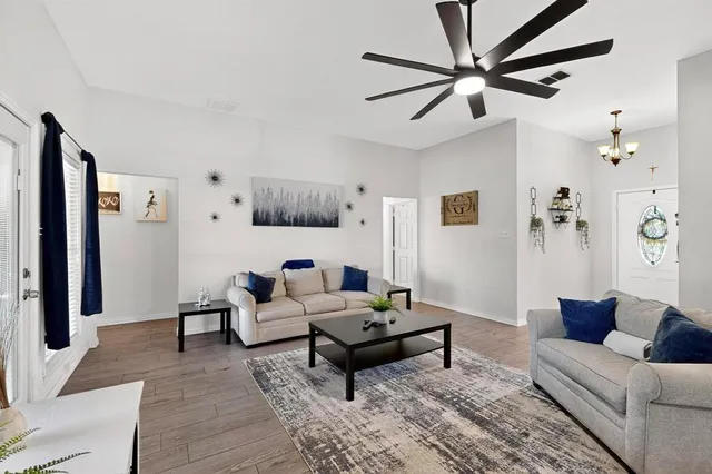 a living room with furniture and a rug