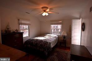 10504 Amherst Avenue Silver Spring, MD 20902 - Photo 12 of 21 a bed sitting in a bedroom next to a window