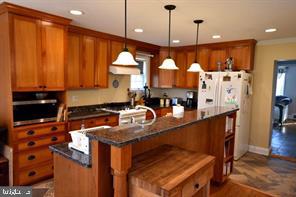10504 Amherst Avenue Silver Spring, MD 20902 - Photo 3 of 21 a kitchen with stainless steel appliances granite countertop a stove a sink and a refrigerator