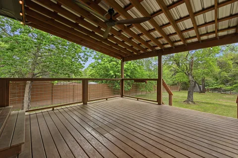 a view of porch with wooden floor