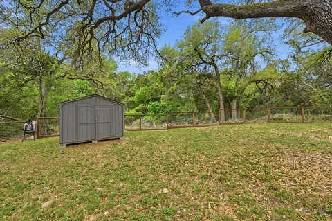 a backyard of a house with lots of green space