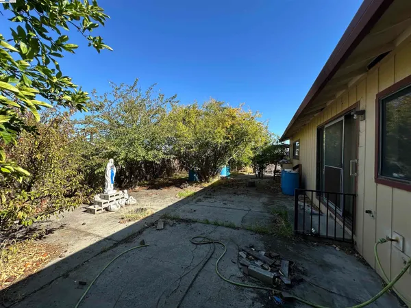 a view of a yard with an outdoor space