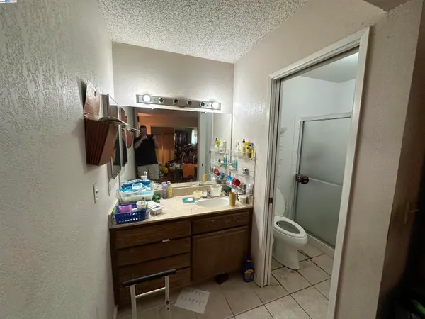 a bathroom with a sink vanity and mirror