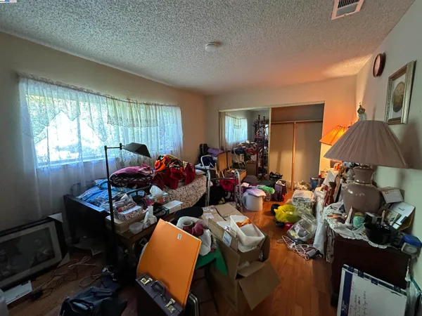 a very nice looking living room with furniture a window and a lamp