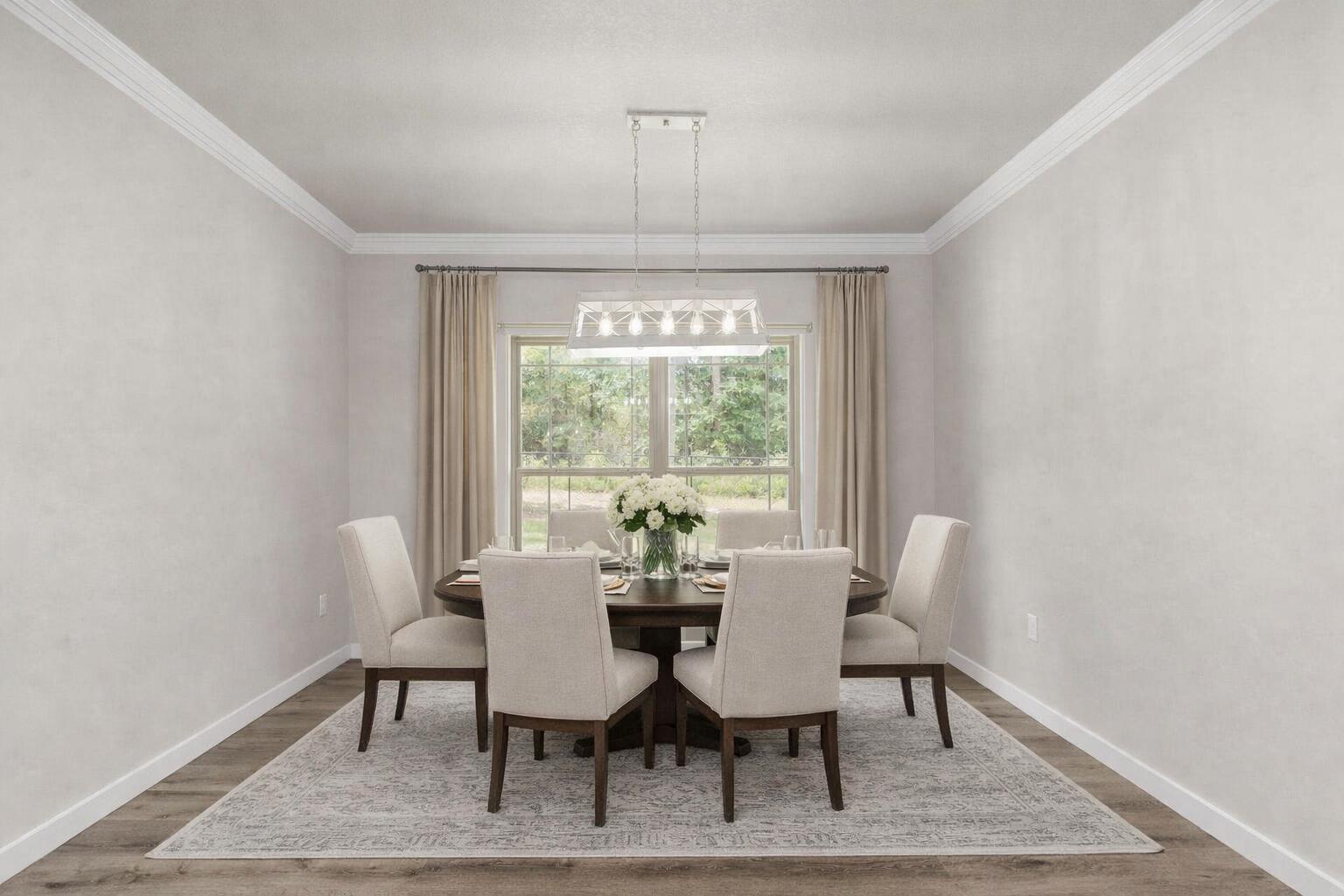 6437 Amanda Court Crestview, FL 32536 - Photo 12 of 48 a view of a dining room with furniture window and wooden floor