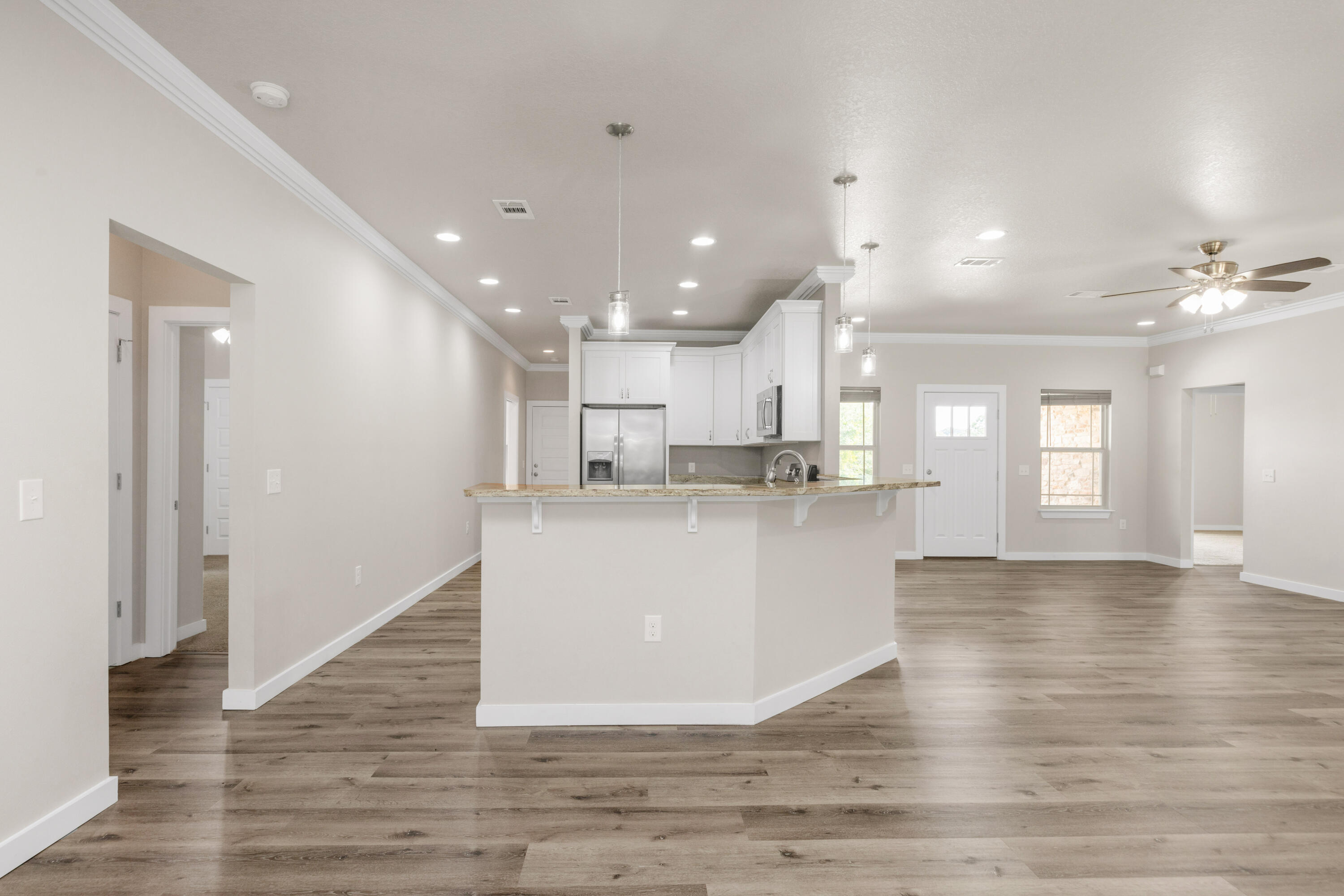 6437 Amanda Court Crestview, FL 32536 - Photo 14 of 48 a view of kitchen with kitchen island wooden floor and center island