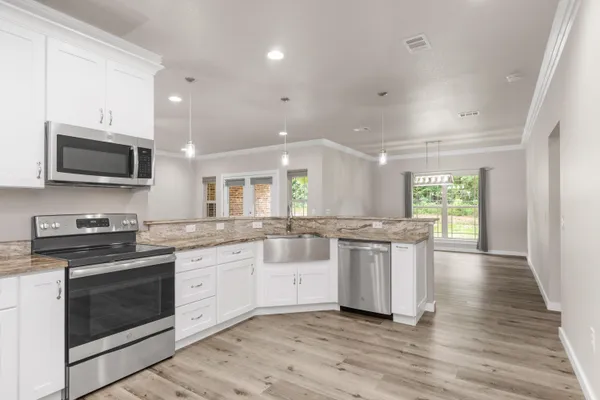 a kitchen with a stove microwave and refrigerator