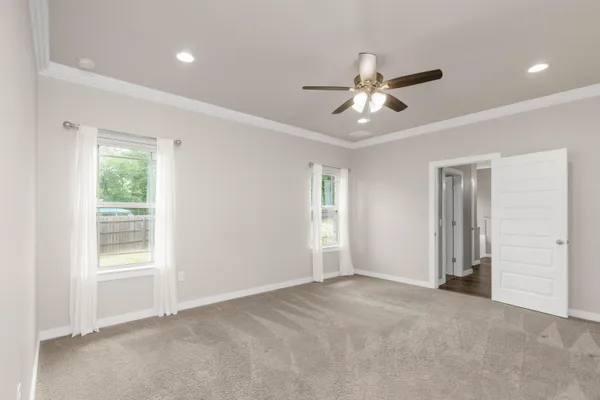 a bathroom with a double vanity sink toilet and shower