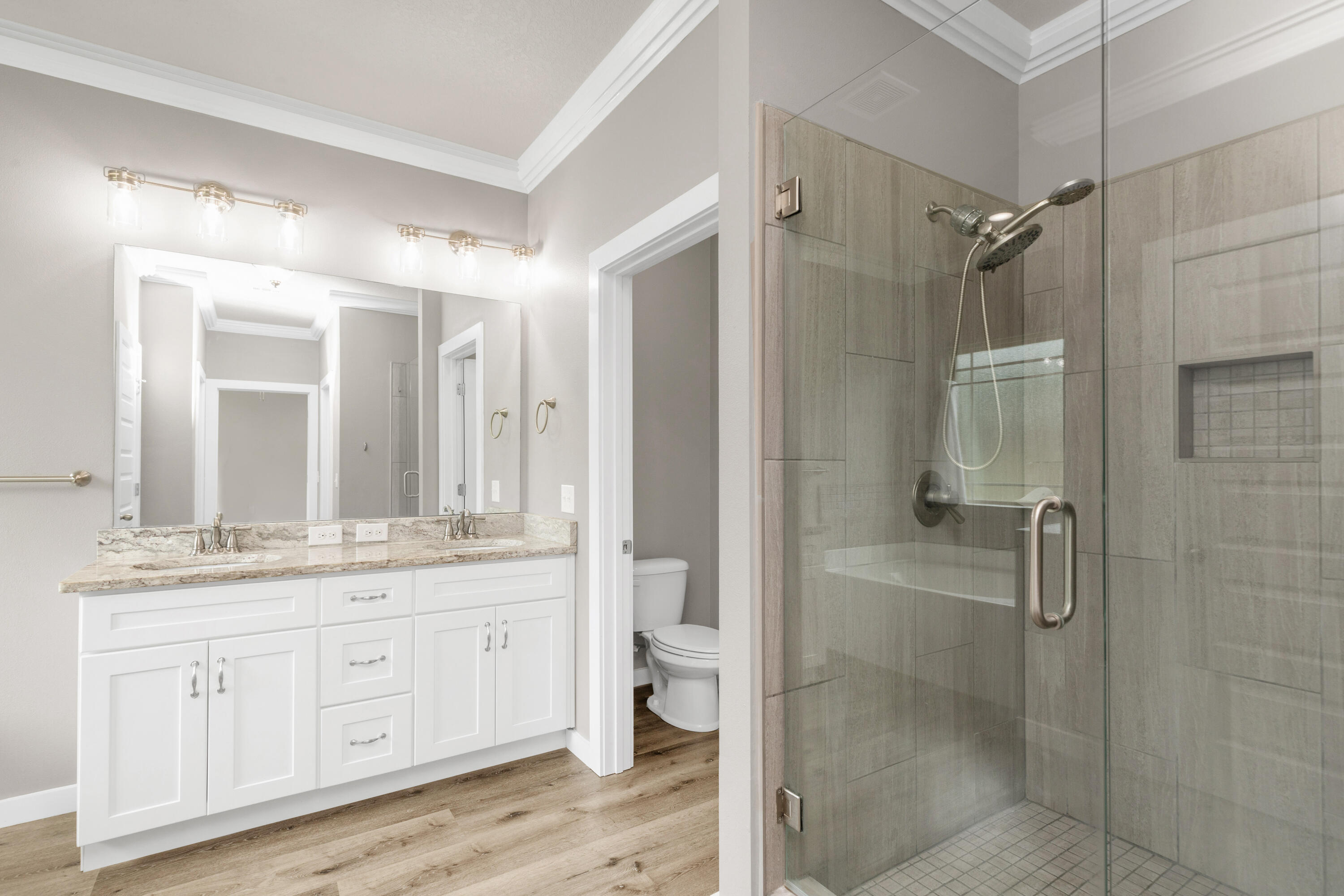 6437 Amanda Court Crestview, FL 32536 - Photo 25 of 48 a bathroom with a double vanity sink toilet and shower