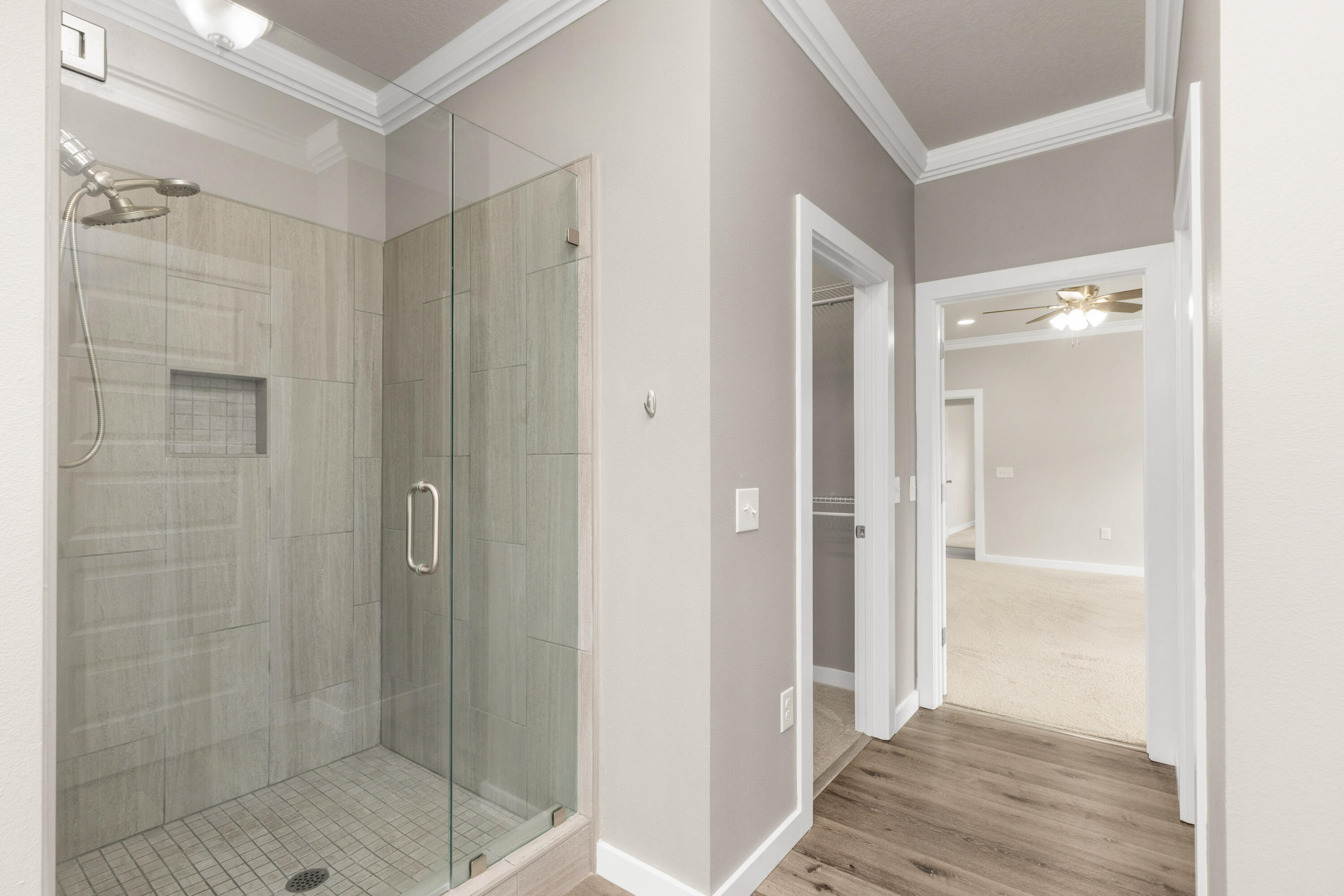 6437 Amanda Court Crestview, FL 32536 - Photo 27 of 48 a bathroom with a shower and a glass door