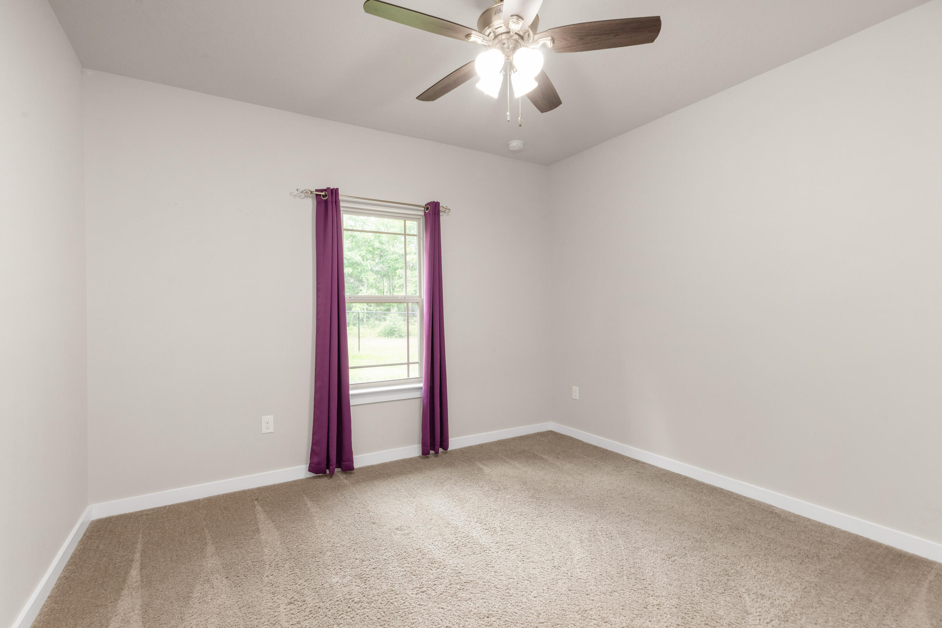 6437 Amanda Court Crestview, FL 32536 - Photo 30 of 48 an empty room with a empty space and a ceiling fan