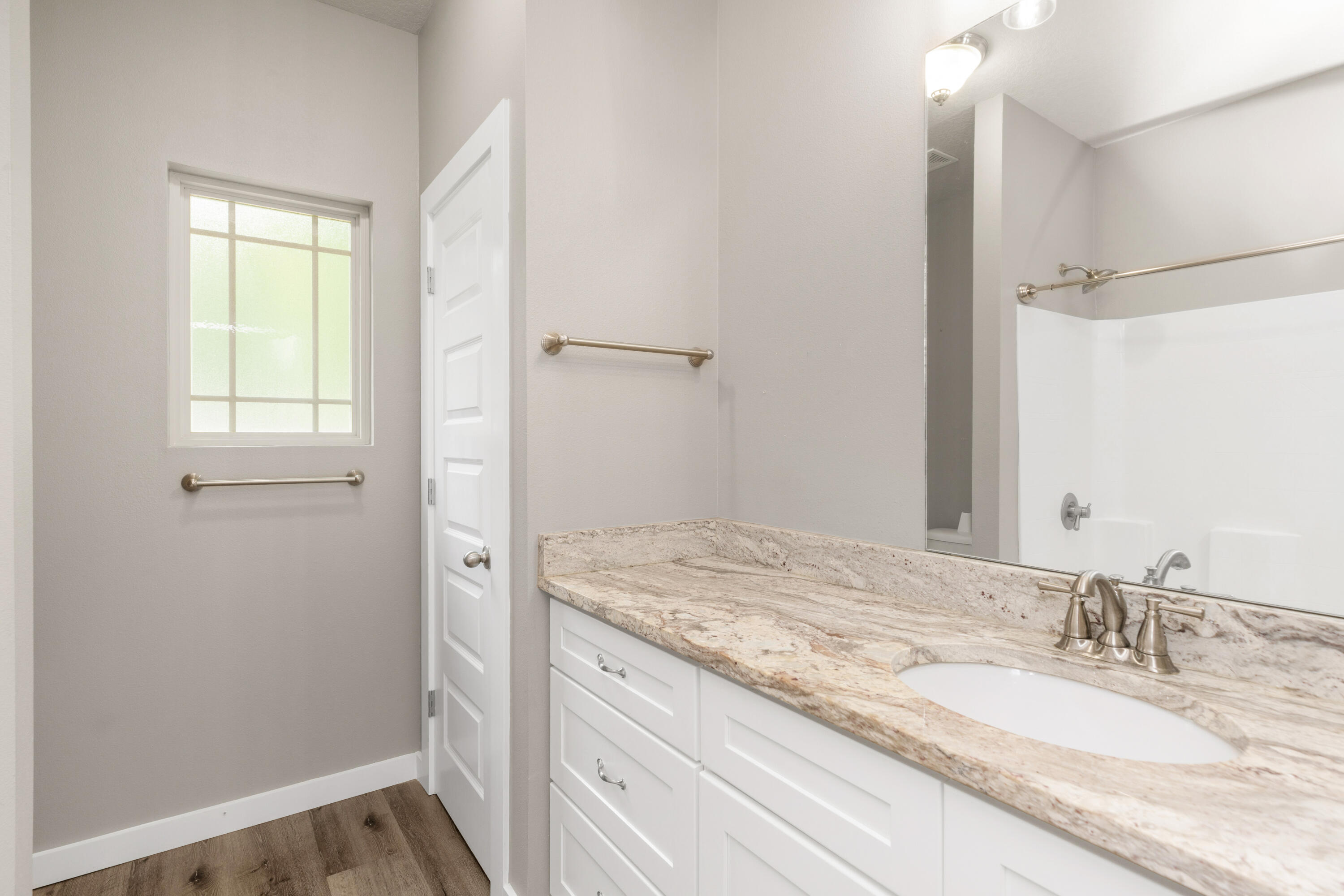 6437 Amanda Court Crestview, FL 32536 - Photo 34 of 48 a bathroom with a granite countertop sink and a mirror