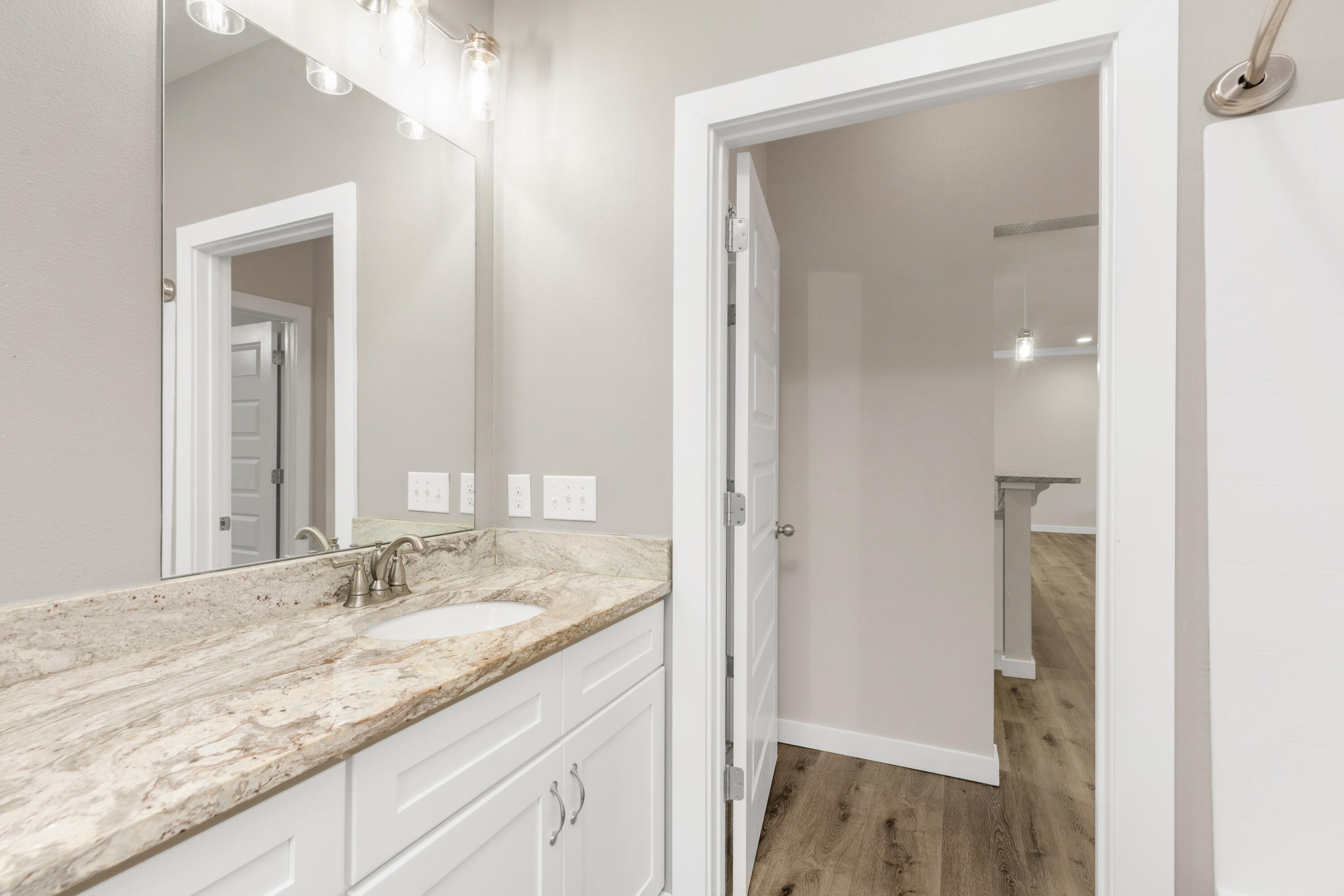 6437 Amanda Court Crestview, FL 32536 - Photo 35 of 48 a bathroom with a granite countertop sink and a mirror