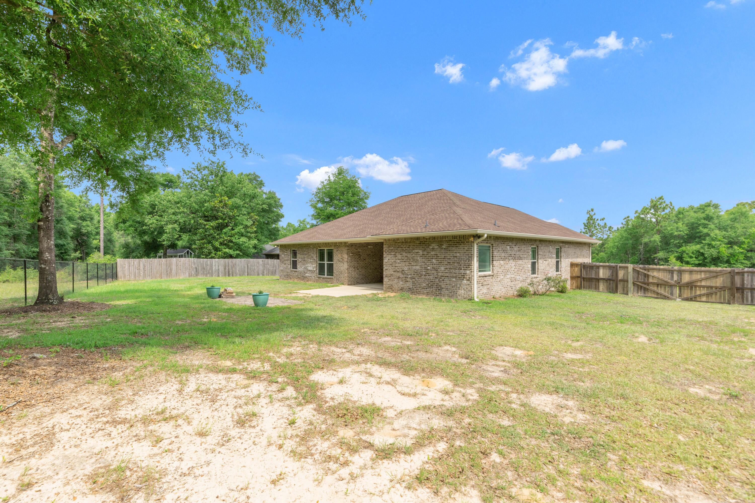 6437 Amanda Court Crestview, FL 32536 - Photo 45 of 48 a front view of a house with a yard