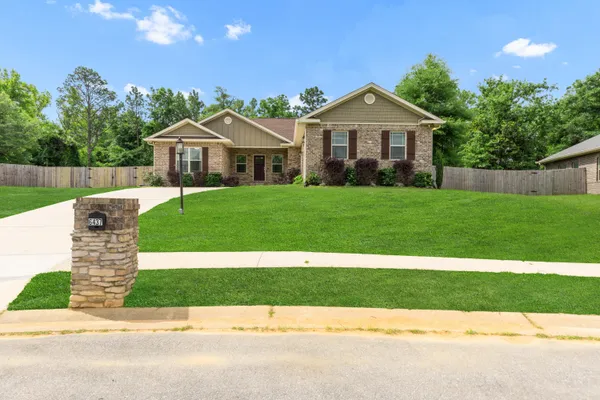 a front view of a house with yard