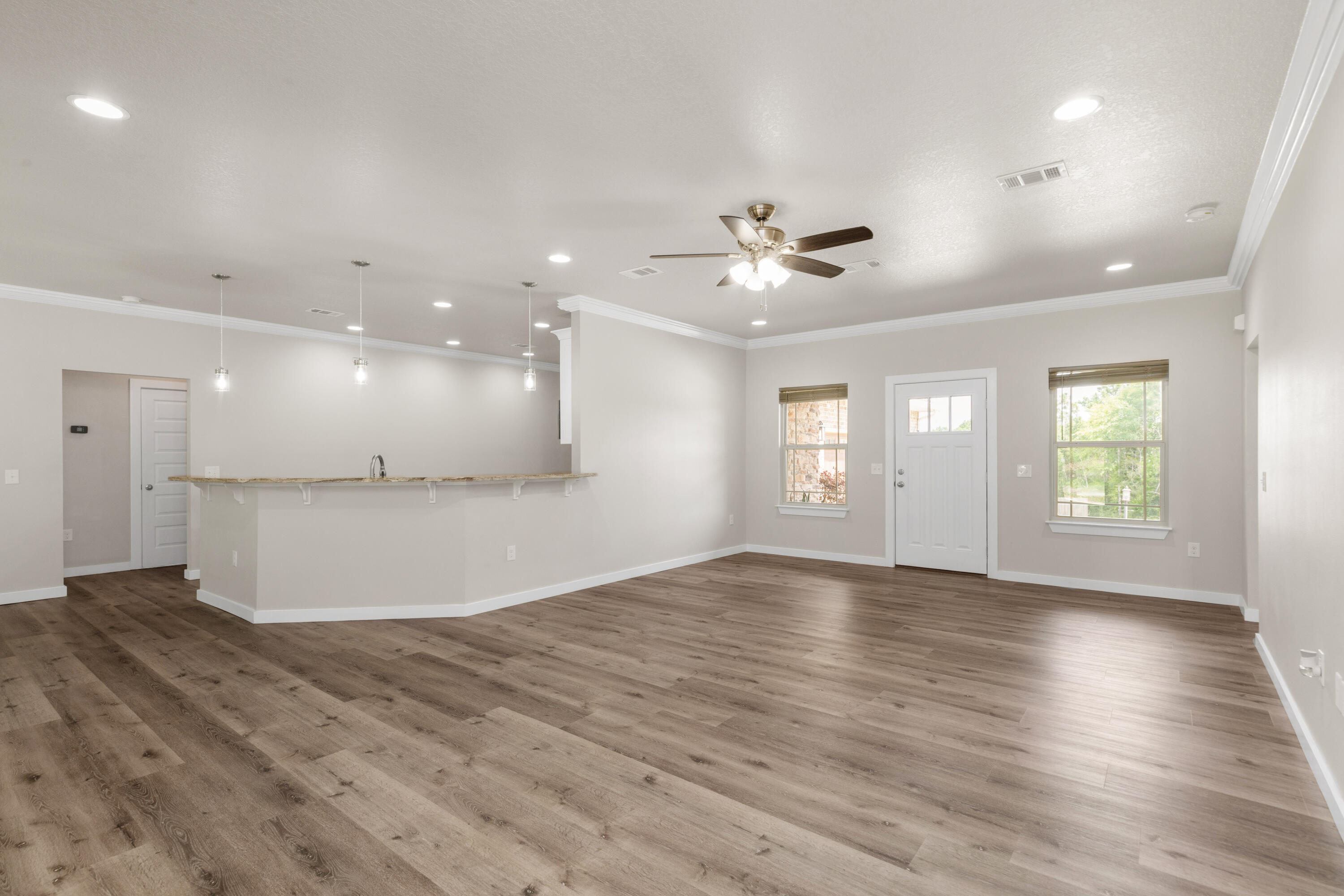 6437 Amanda Court Crestview, FL 32536 - Photo 9 of 48 an empty room with windows and ceiling fan