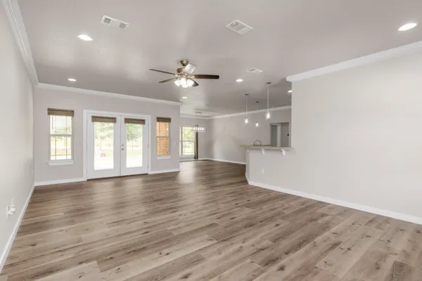 a view of kitchen and kitchen with stainless steel appliances