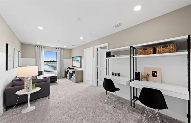 a bedroom with a bed a large window and mirror